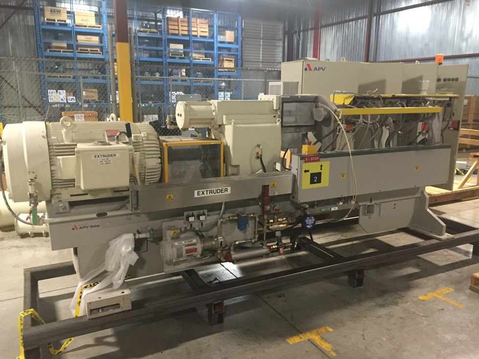 ***SOLD*** used APV Baker Perkins Model MP80 Twin Screw mixer/extruder. 80 mm Screws with 25:1 L/D ratio. Typical Outputs 1500-2900 (kg/h).  (6) Zone Electrically heated, water cooled.  Max operating temp. 200 deg.C. (392 deg.F.)  Driven by a Reliance 225 HP, 460 volt Inverter Duty motor. Variable speed from 0-600 rpm. Control cabinet included.  	